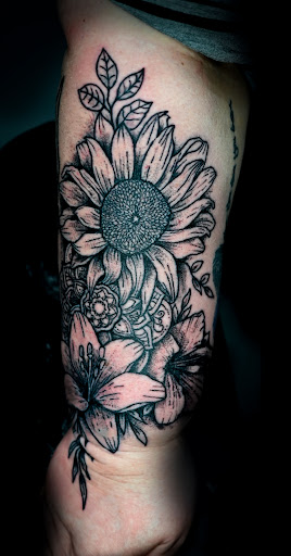 Explore cherry blossom tattoo ideas, creative tattoo ideas in Saint Petersburg, available at Phoebus Tattoos