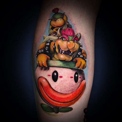 Explore joker hand tattoo ideas, creative tattoo ideas in Washington, available at Trilogy Atelier - DC Tattoo Shop Piercing Studio