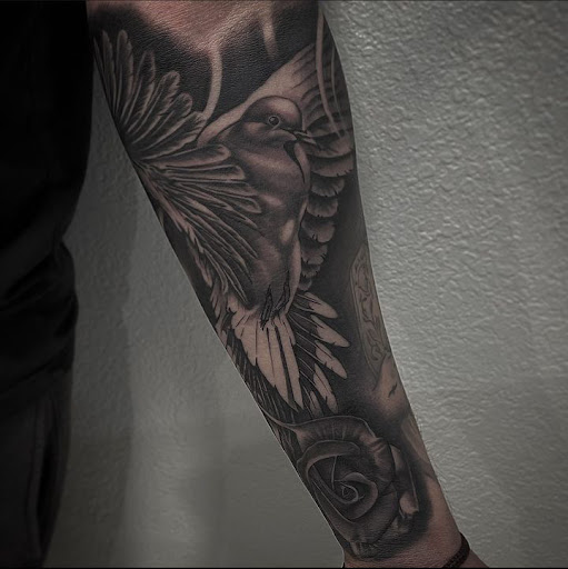 Explore raven tattoo ideas, creative tattoo ideas in Denver, available at The Elegant Elephant Tattoo