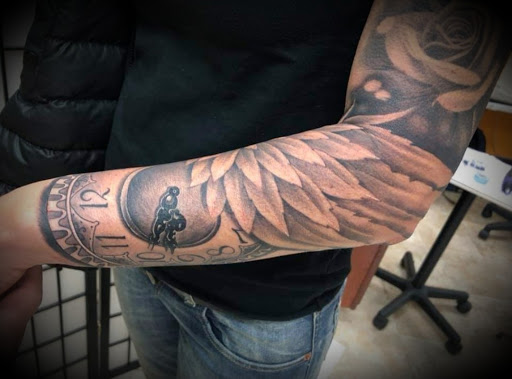 Explore animal sleeve tattoo ideas, creative tattoo ideas in Ambler, available at Tattoo GalaxyAmbler Piercing & Custom Tattoos