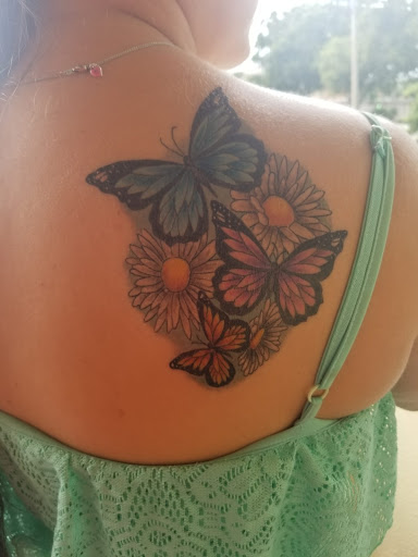 Explore chest tattoo lettering ideas, creative tattoo ideas in Saint Petersburg, available at Edens Apple Tattoos and Piercings