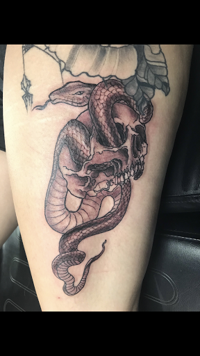 Find between breast tattoo ideas for your next unique tattoo in Granite City at DenWinn Art & Design