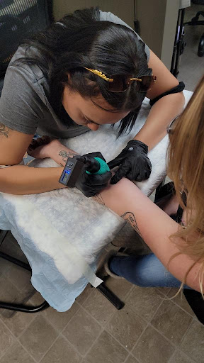 Explore red string tattoo ideas, creative tattoo ideas in Portsmouth, available at GREGS TATTOOS LLC