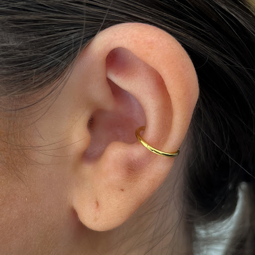 Find tattoo ideas between breast for your next unique tattoo in Hatboro at Sky Blue Piercing