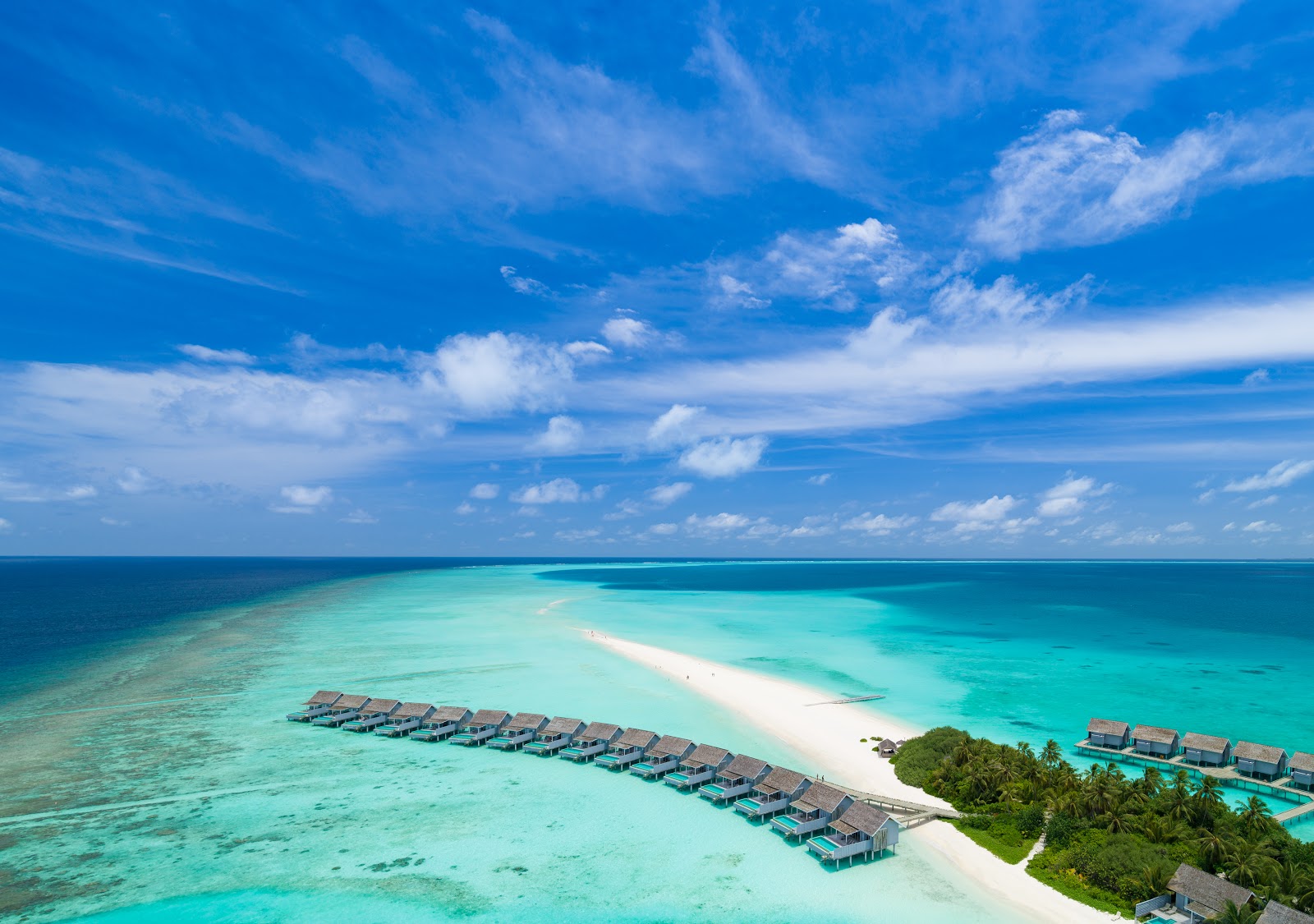 Photo of Kuramathi Resort Island with turquoise pure water surface