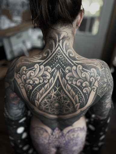 Explore bass tattoo ideas, creative tattoo ideas in Galena, available at Studio C Tattoo
