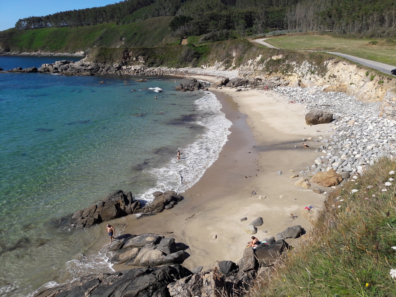 Foto di Praia de Muinelo con una superficie del sabbia beige