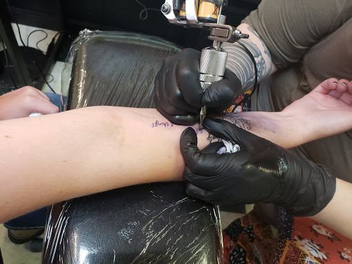 Explore half leg sleeve tattoo ideas for men, creative tattoo ideas in Powell, available at AVALON COVE TATTOO