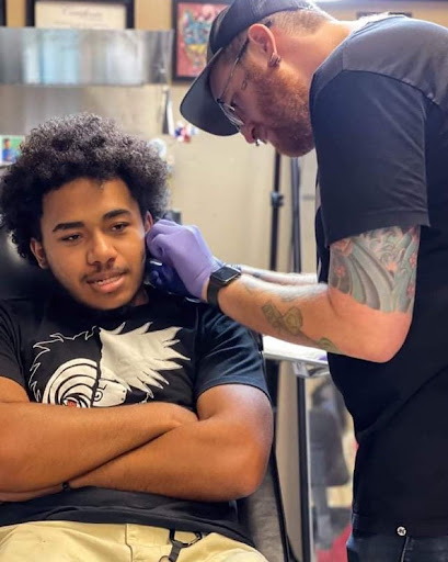 Find women's rib tattoo ideas for your next unique tattoo in Augusta at Mr. Tattoo