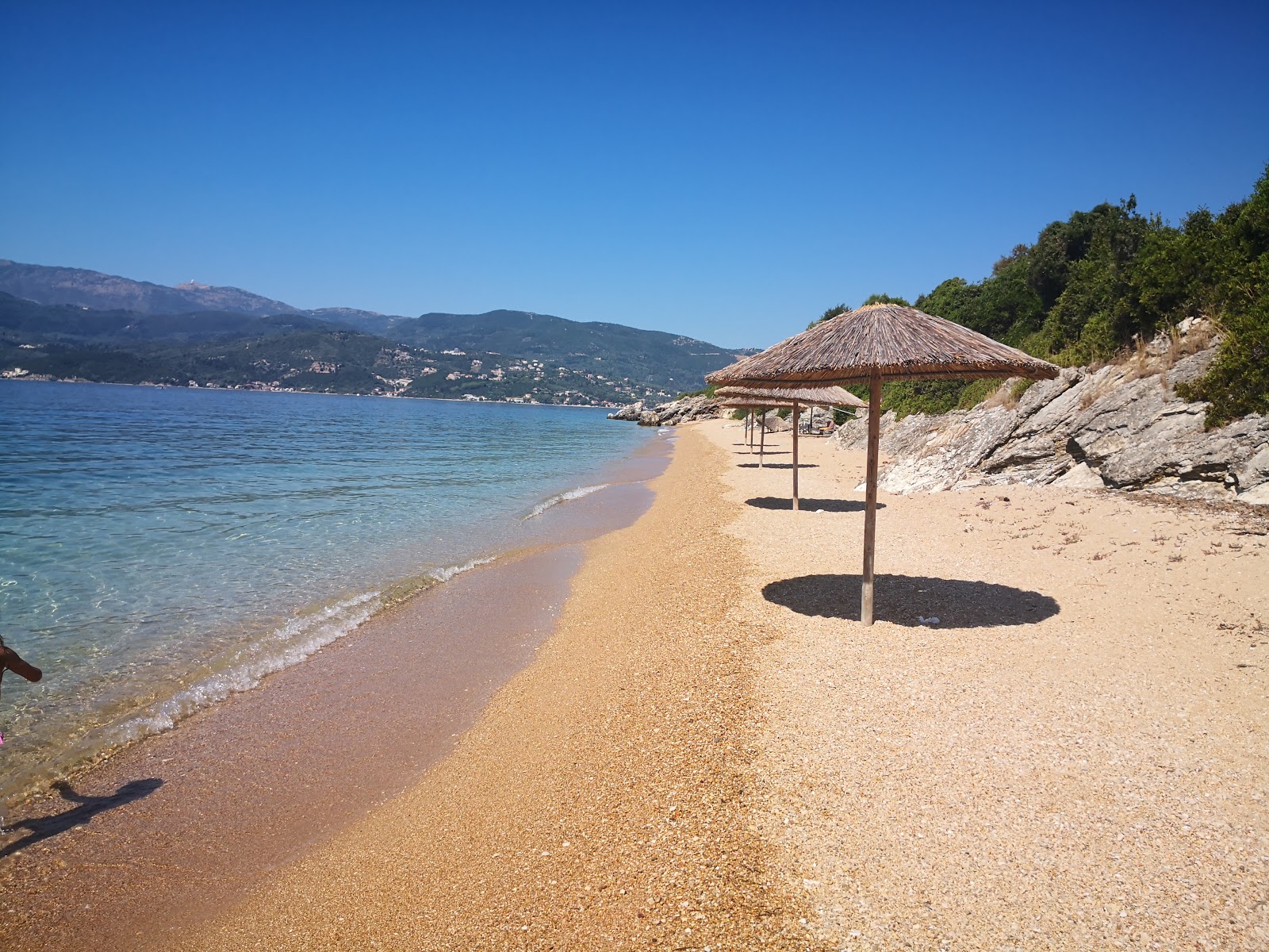 Photo of Lygia beach with light fine pebble surface