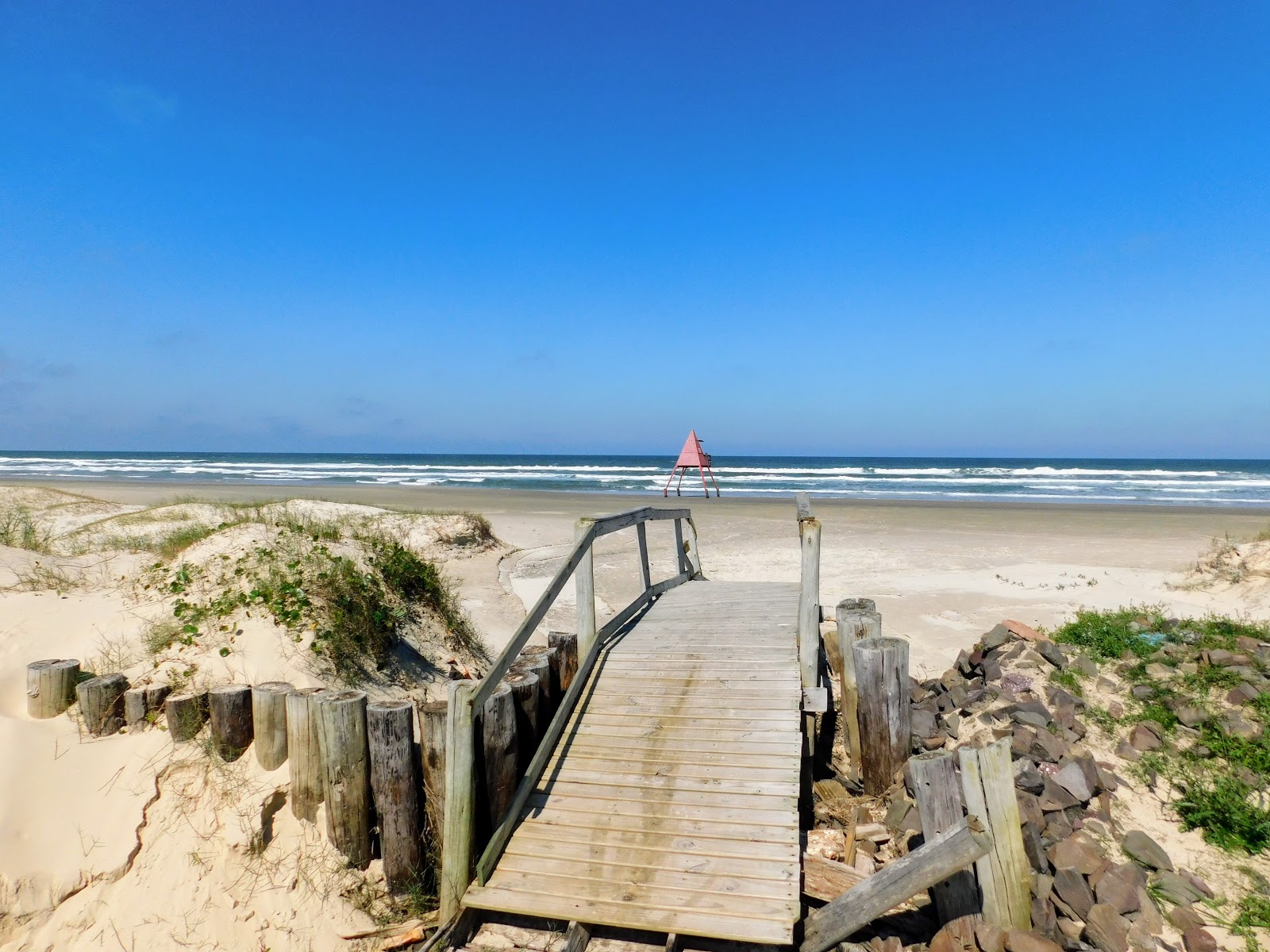 Foto de Praia Maristela com areia fina e brilhante superfície