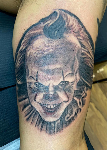 Explore cartoon tattoo ideas for men, creative tattoo ideas in Chicago, available at Shreds Inferno Custom Tattoos