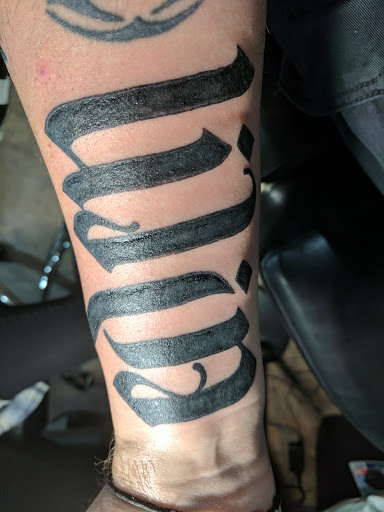 Explore thigh flower tattoo ideas, creative tattoo ideas in Waverly, available at Twisted Fate Tattoos