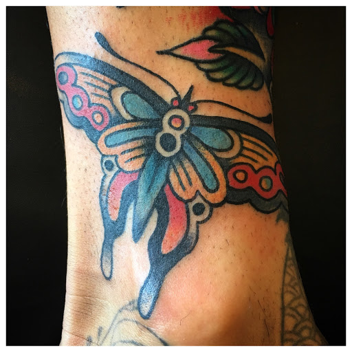 Explore love and war tattoo ideas, creative tattoo ideas in Warrenville, available at NoodlesTattoo Co. & Studio