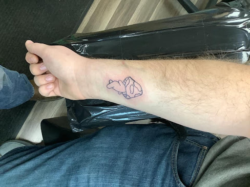 Find small tattoo between breast ideas for your next unique tattoo in Bradley at Rogers Tattooing & Body Piercing