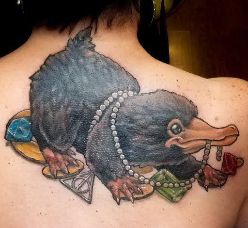 Explore women's bum tattoo ideas, creative tattoo ideas in Denver, available at CREATUREARCADE TATTOO AND ILLUSTRATION-LOCATED IN LAKEWOOD CO