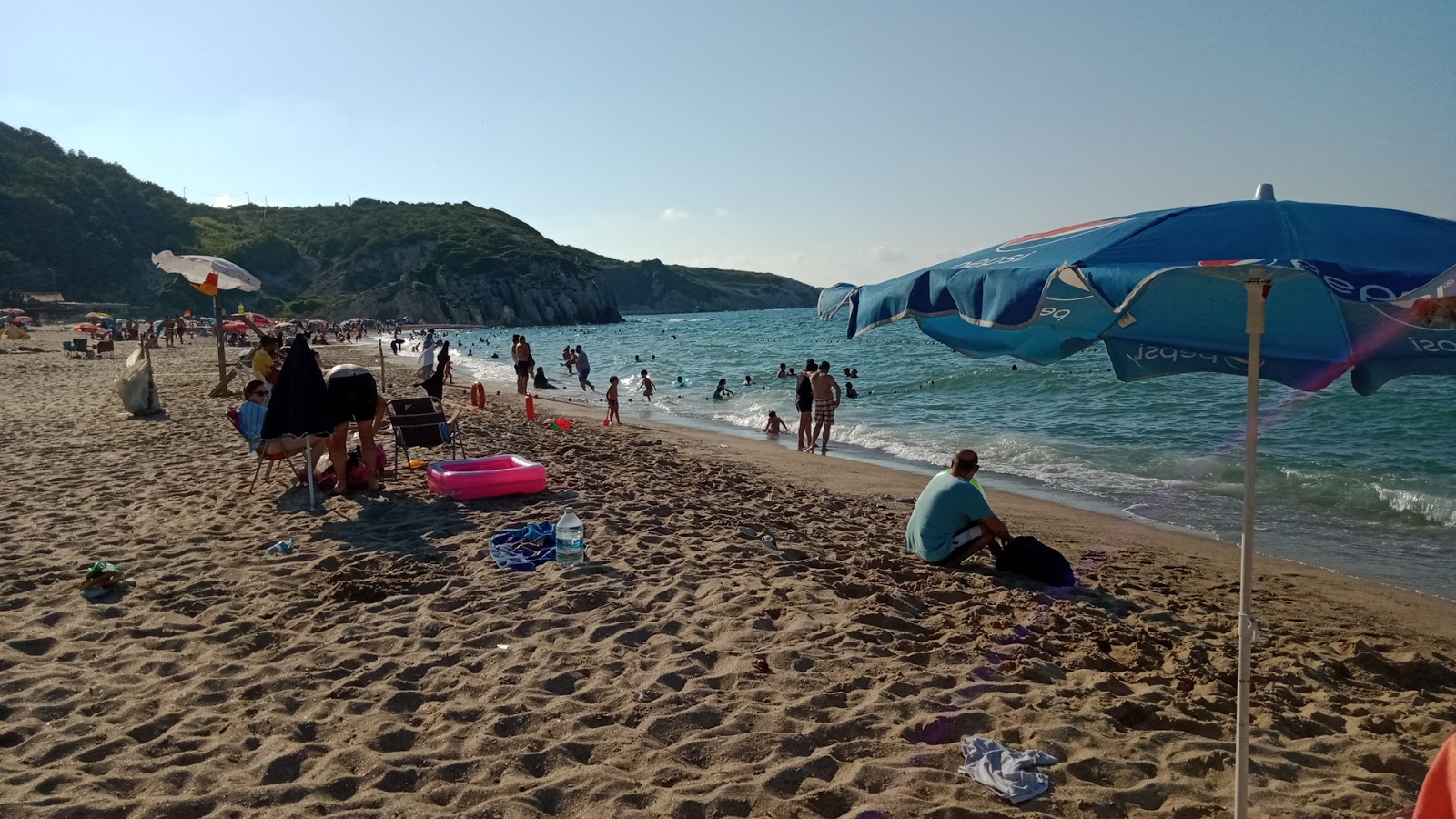 Foto di Kabakoz Koyu Plaji con una superficie del sabbia beige