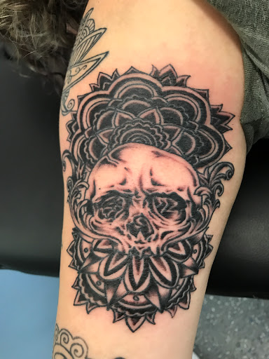 Explore arm sleeve tattoo ideas woman, creative tattoo ideas in Muncie, available at The Tattoo Studio