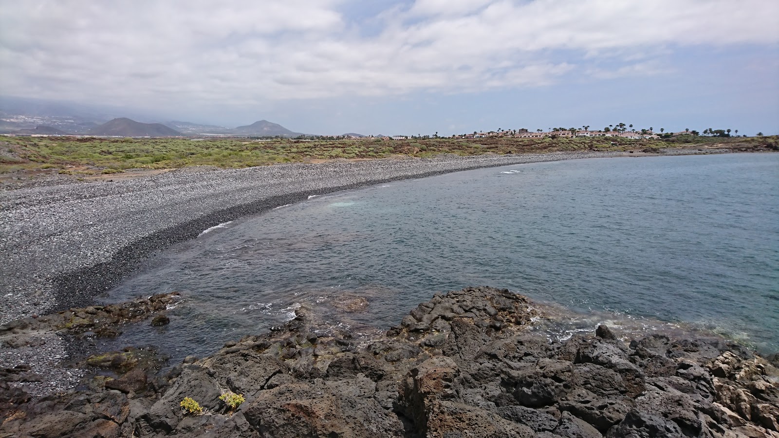 Foto av Playa Colmenares med liten vik