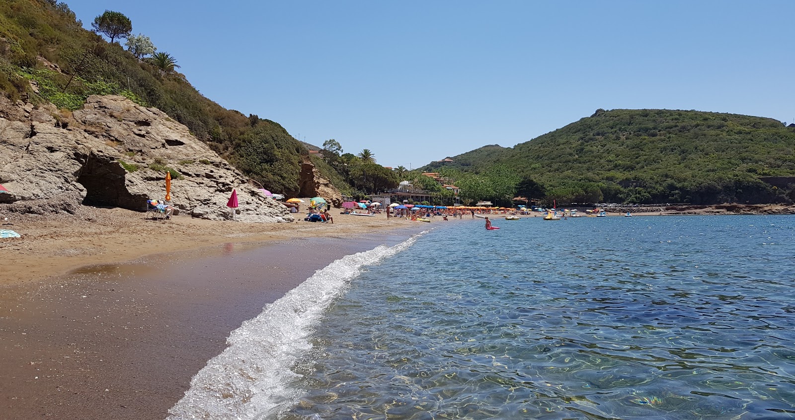 Foto de Cala dell'Innamorata com areia marrom superfície