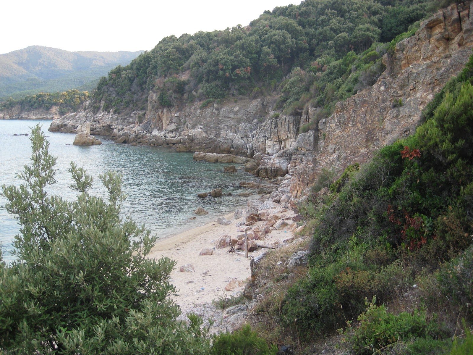 Photo of Stagira Beach with bright sand & rocks surface