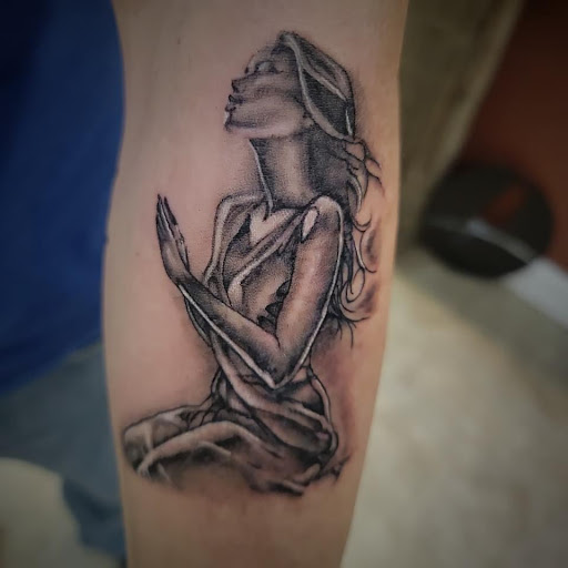 Explore cross tattoo sleeve ideas, creative tattoo ideas in Nashville, available at RedBird Tattoo