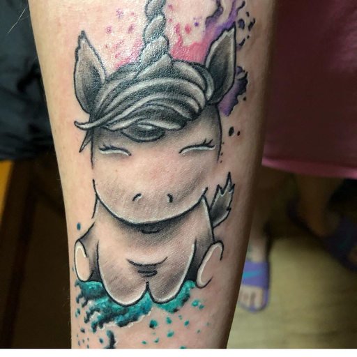Find dino tattoo ideas for your next unique tattoo in Baytown at Big Juniors Tattoos
