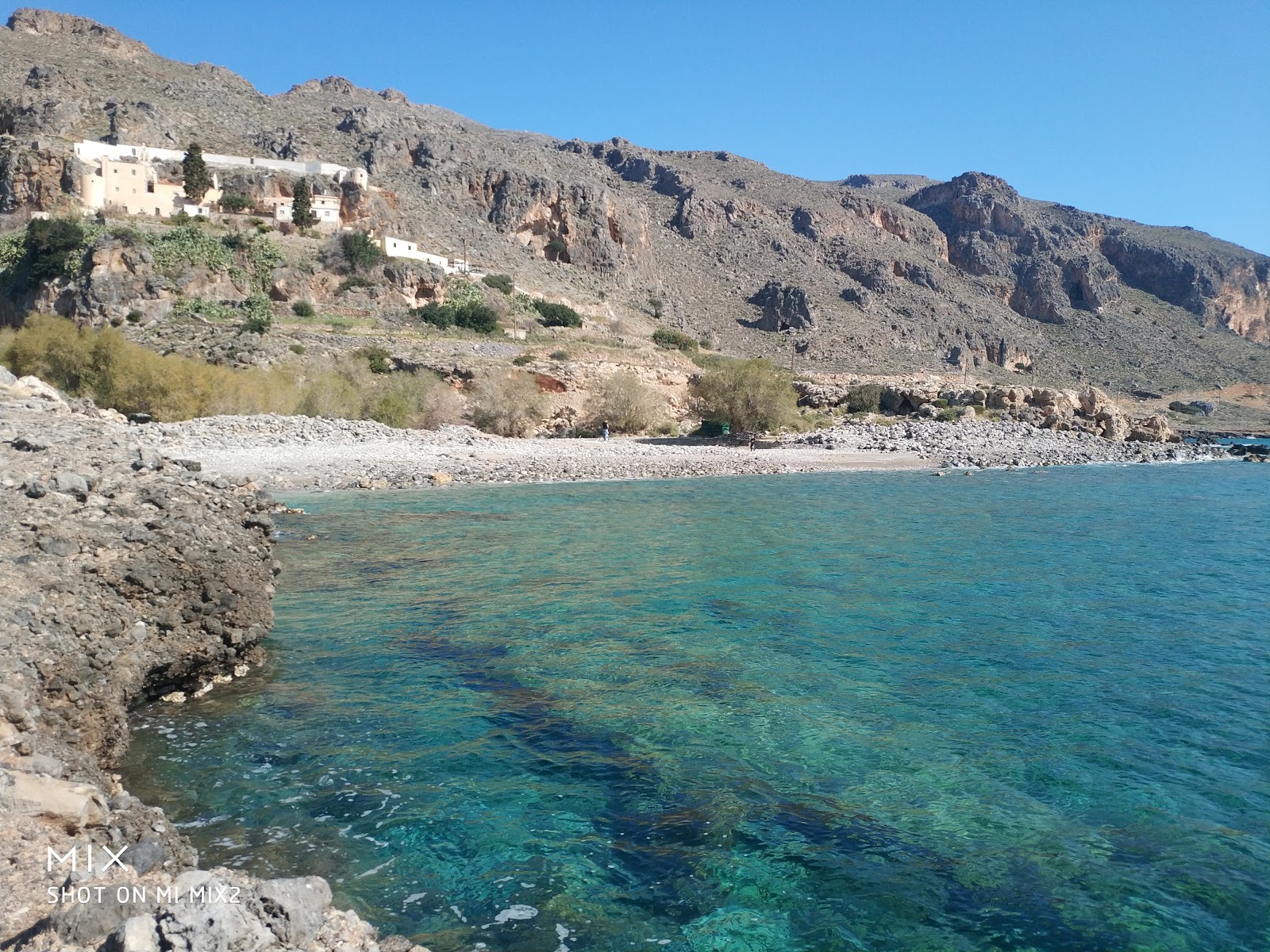 Foto av Kapsa beach med stenar yta
