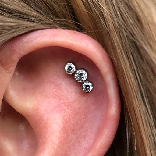 Explore tattoo ideas for women's legs, creative tattoo ideas in Dover, available at Agap Body Piercings