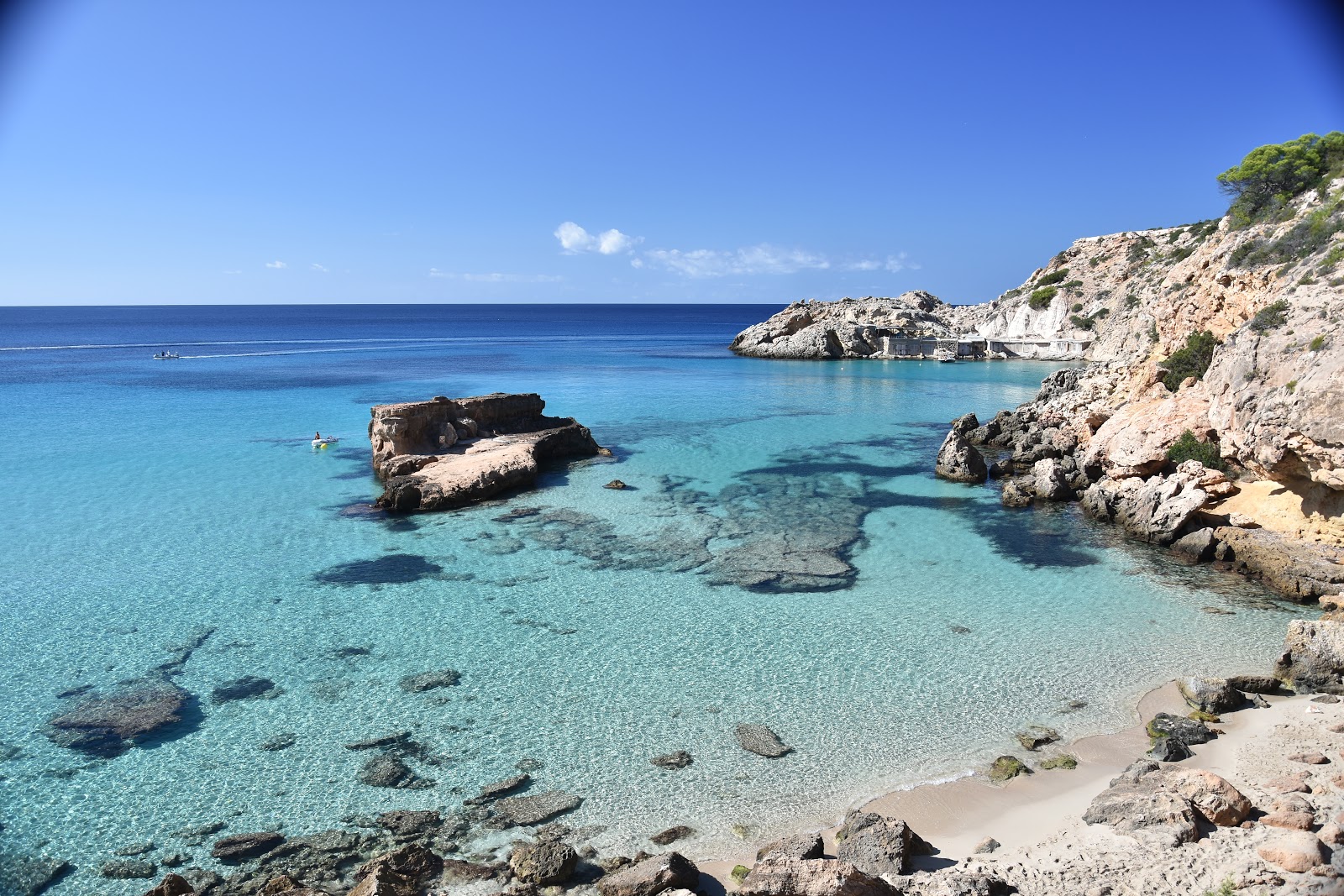 Photo of Cala Tarida pequena with bright fine sand surface