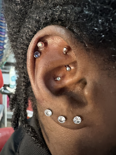 Find middle boob tattoo ideas for your next unique tattoo in Kingsland at These Colors Dont Run Tattoo & Piercing