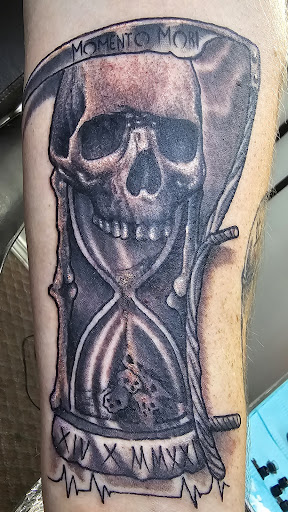 Explore religious tattoo sleeve ideas, creative tattoo ideas in Angola, available at Hoodlum Ink