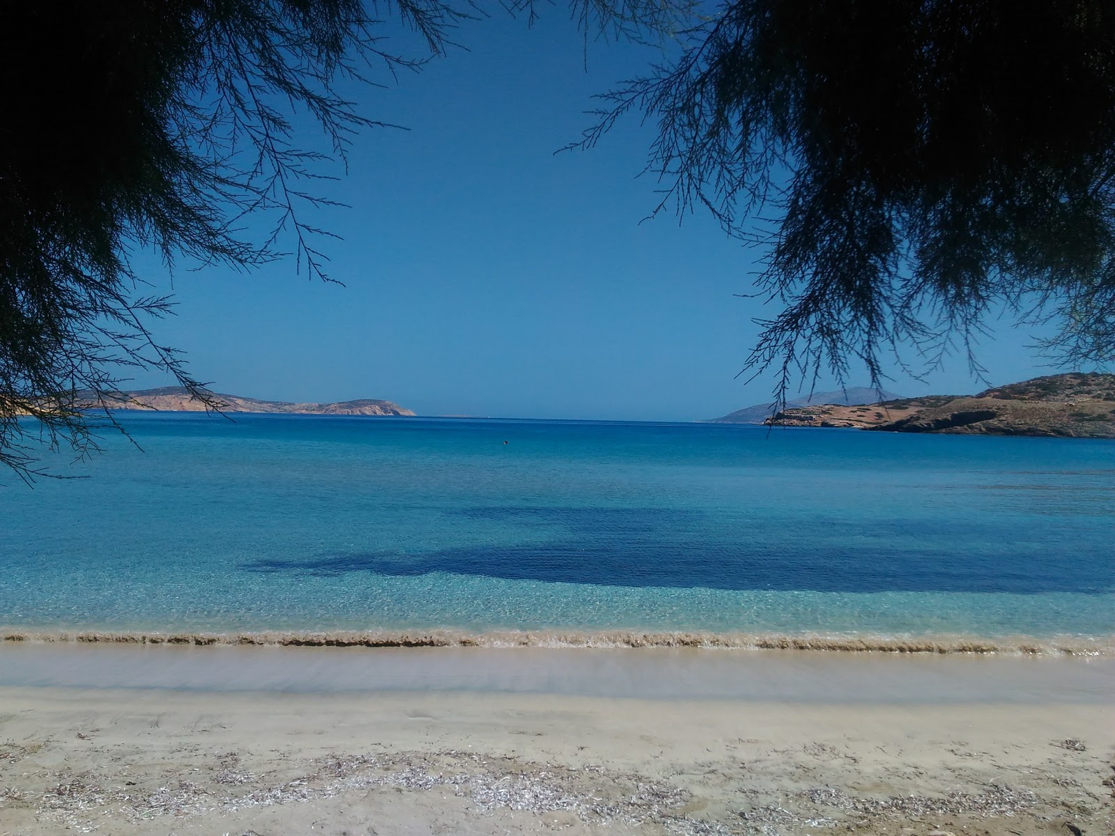 Foto van Almyros beach met turquoise puur water oppervlakte