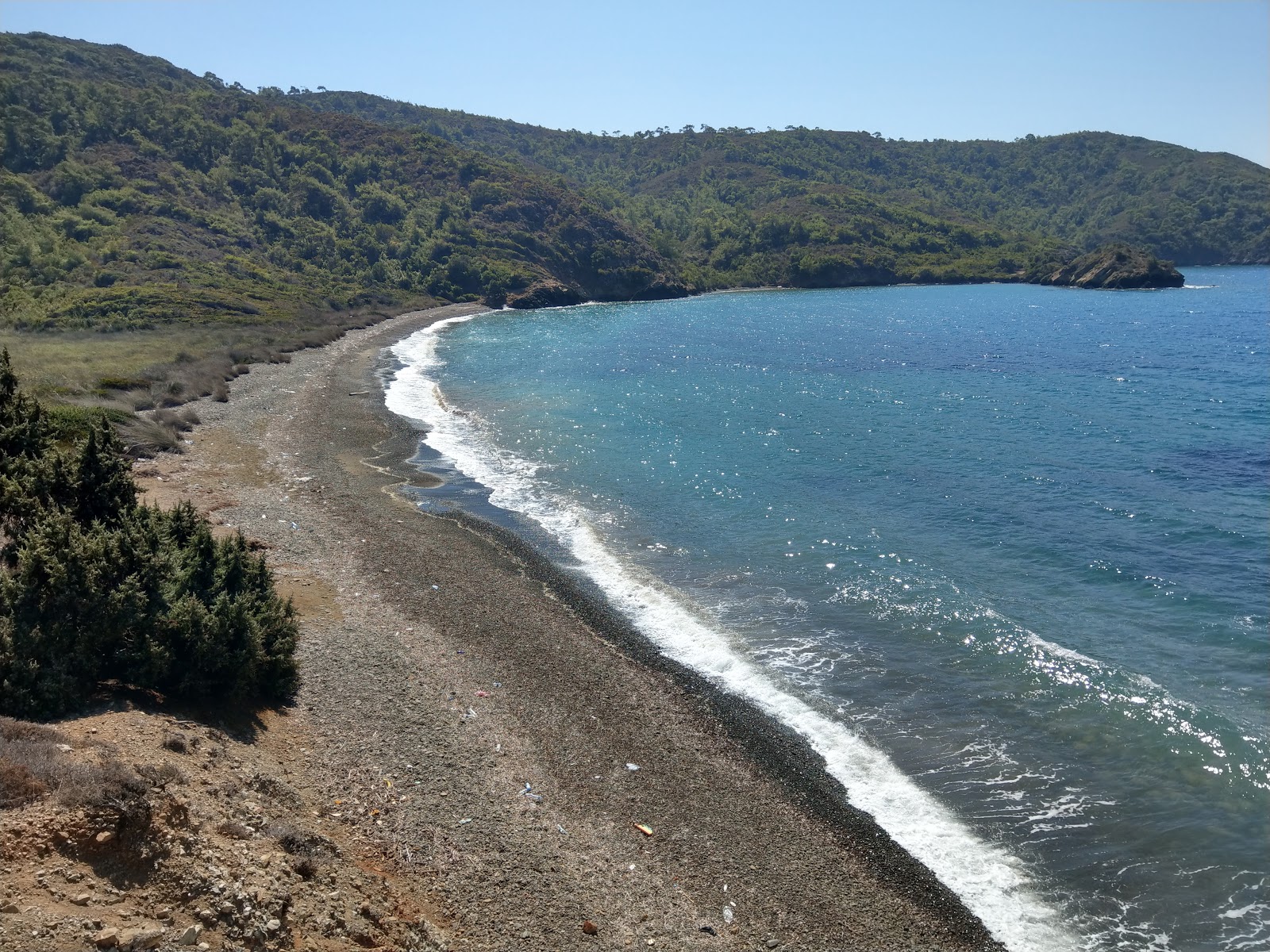 Foto di Kufre Bay beach IV con una superficie del ciottoli grigi
