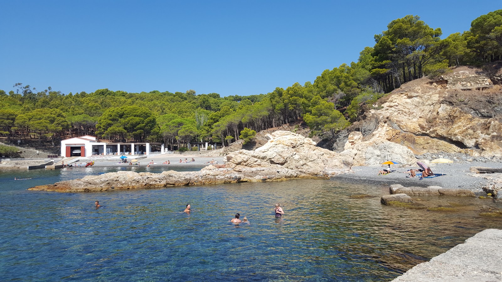 Photo of Port De Joan with blue pure water surface