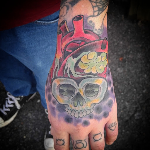 Explore marigold tattoo ideas, creative tattoo ideas in Gadsden, available at Sacred Art Tattoo Company