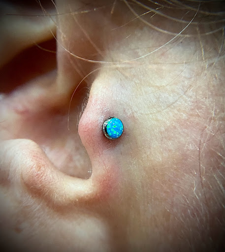 Explore gap filling tattoo ideas, creative tattoo ideas in Orange, available at Symbiosis Body Piercing