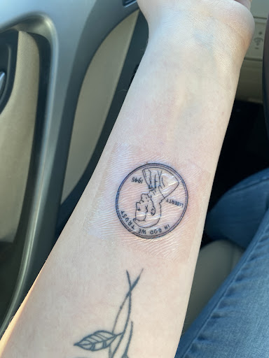 Explore middle neck tattoo ideas, creative tattoo ideas in Easley, available at Peach Pit Tattoo
