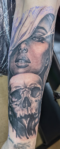 Explore cover up tattoo ideas lower back, creative tattoo ideas in Dallas, available at 2Xtremes Tattoos & Piercing