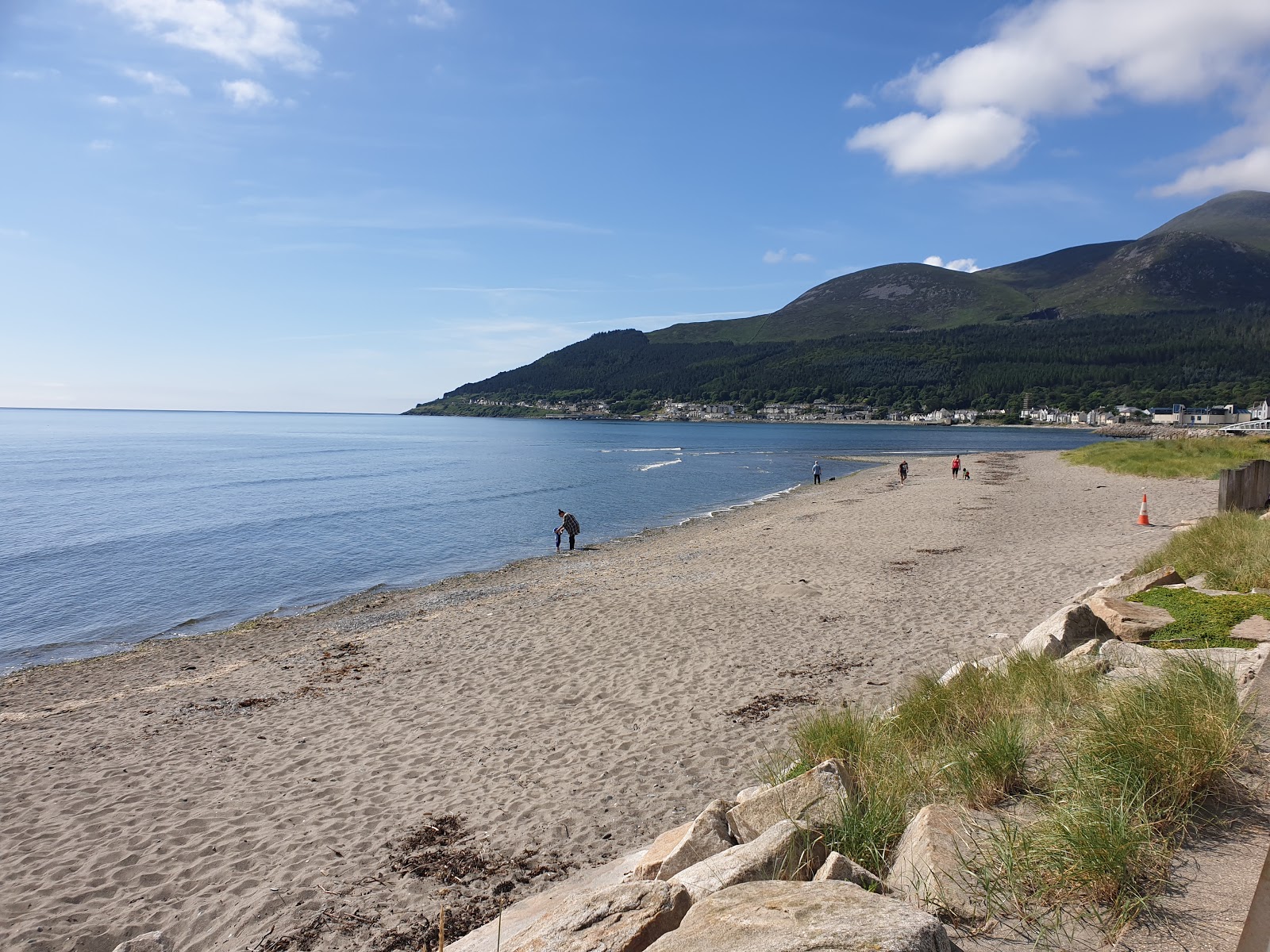 Foto av Newcastle Strand med grå sand yta