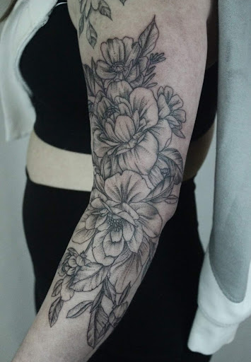 Explore blessed neck tattoo ideas, creative tattoo ideas in Johnstown, available at Lemon Bomb Tattoo Co.