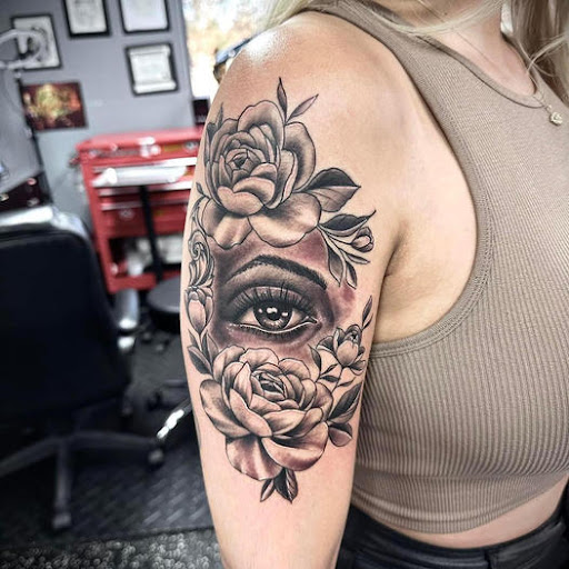 Explore purple flower tattoo ideas, creative tattoo ideas in Fort Myers, available at Loyal 2 The Coil Tattoos & Piercings (Edison Mall Location Entrance F)
