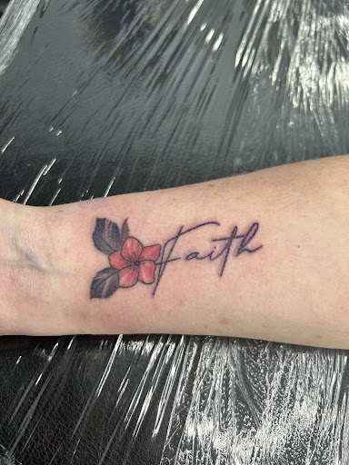Find small tattoo between breast ideas for your next unique tattoo in Rowlett at Sinners Tattoo Studio and Supply