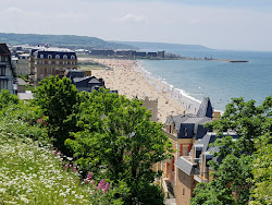 Photo of Trouville Beach with turquoise water surface