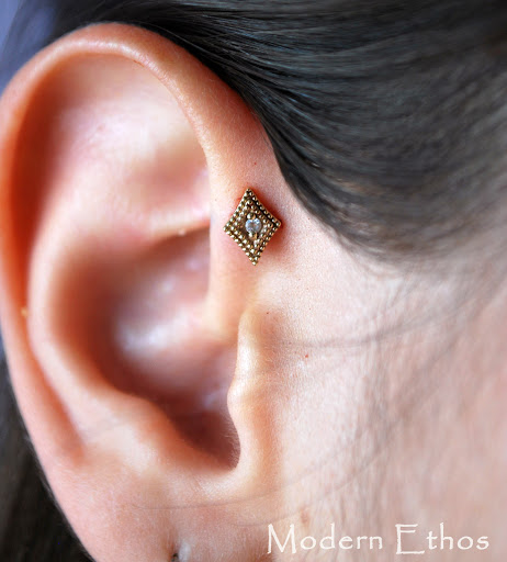 Explore curse mark tattoo ideas, creative tattoo ideas in New Cumberland, available at Modern Ethos Piercing