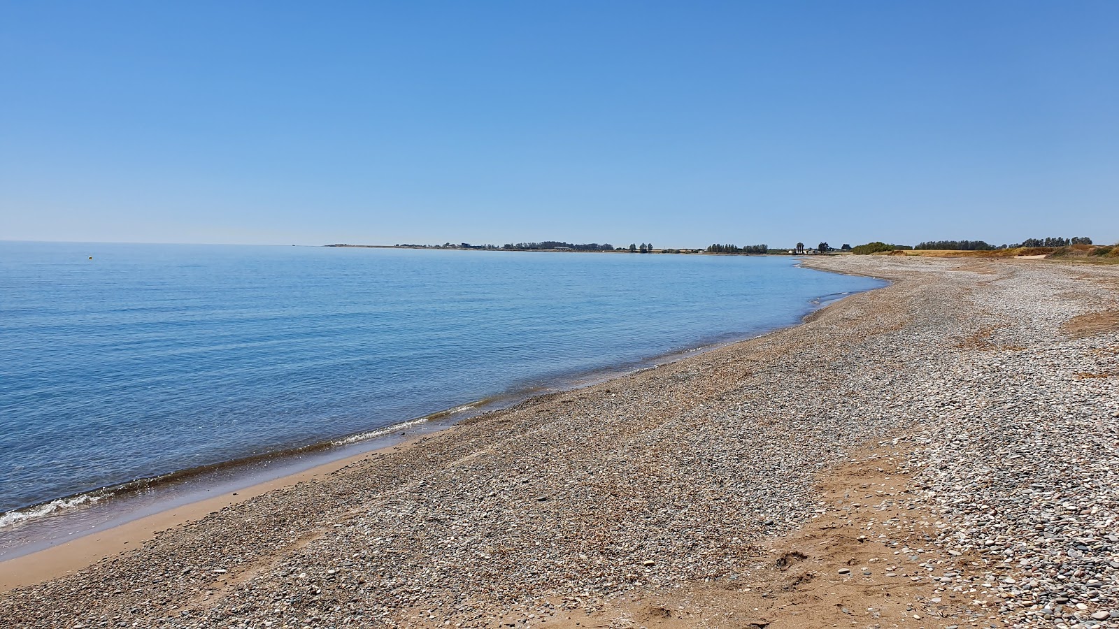 Fotografie cu Mandria beach cu o suprafață de nisip ușor și pietricel