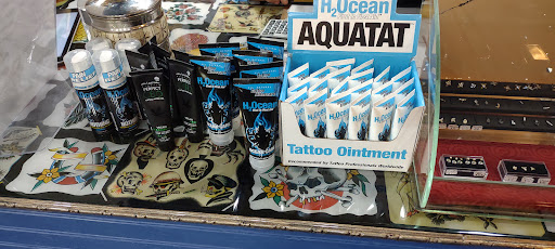 Find charm bracelet tattoo ideas for your next unique tattoo in Lake George at Lake George Tattoo Company