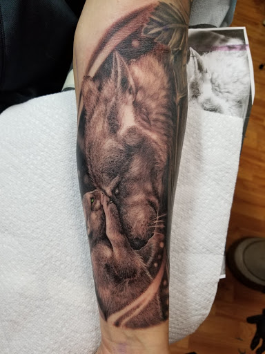 Explore inner bicep tattoo ideas for men, creative tattoo ideas in Pueblo, available at Spellbound Electric Tattoos