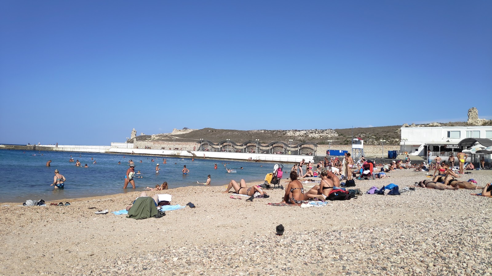 Photo of Sunny beach and the settlement