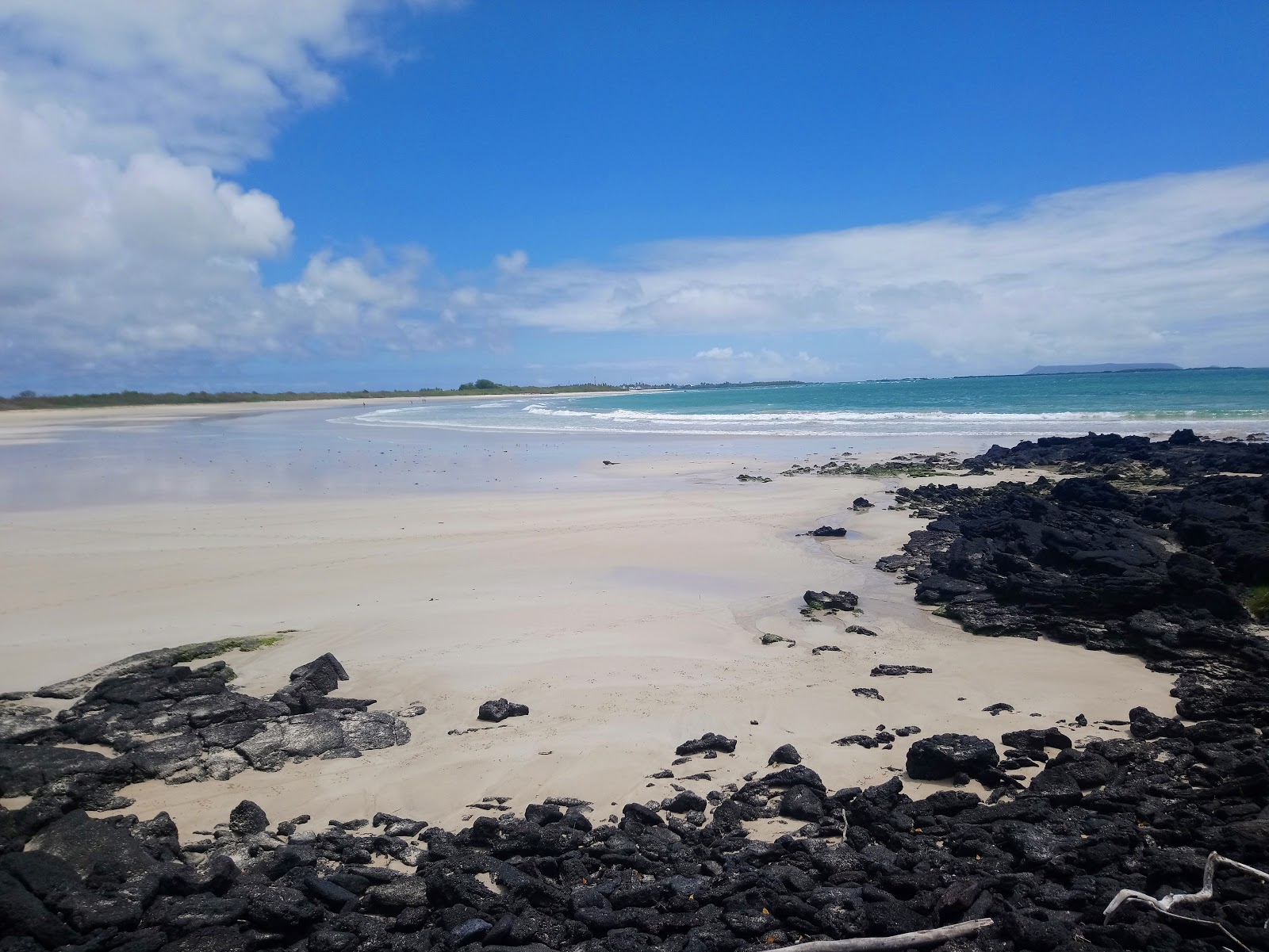 Photo of La Playita with turquoise pure water surface